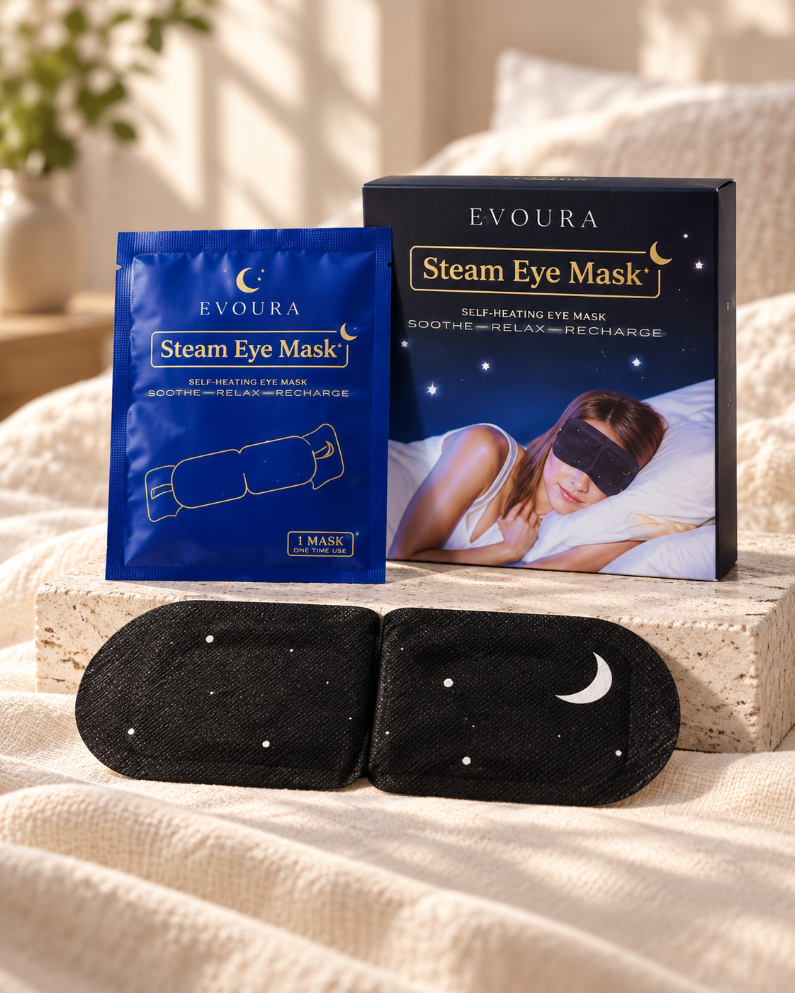 EVOURA Steam Eye Mask box, sealed sachet and mask in a softly lit bedroom